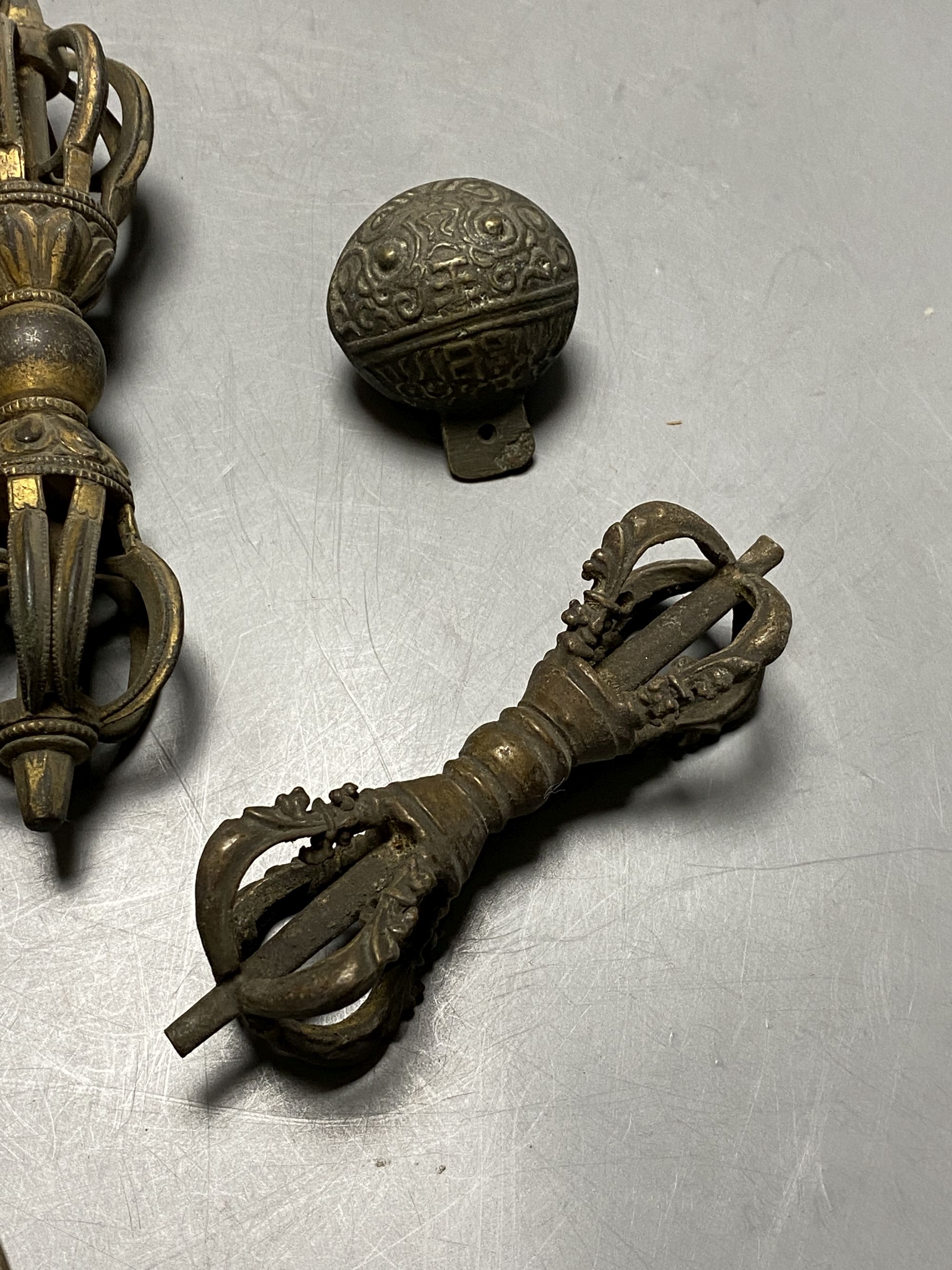 Two Tibetan bronze vajra sceptres and other Buddhist implements, 19th century